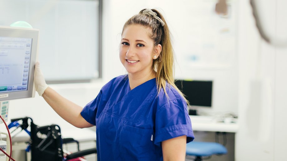 Nurse next to a monitoring device